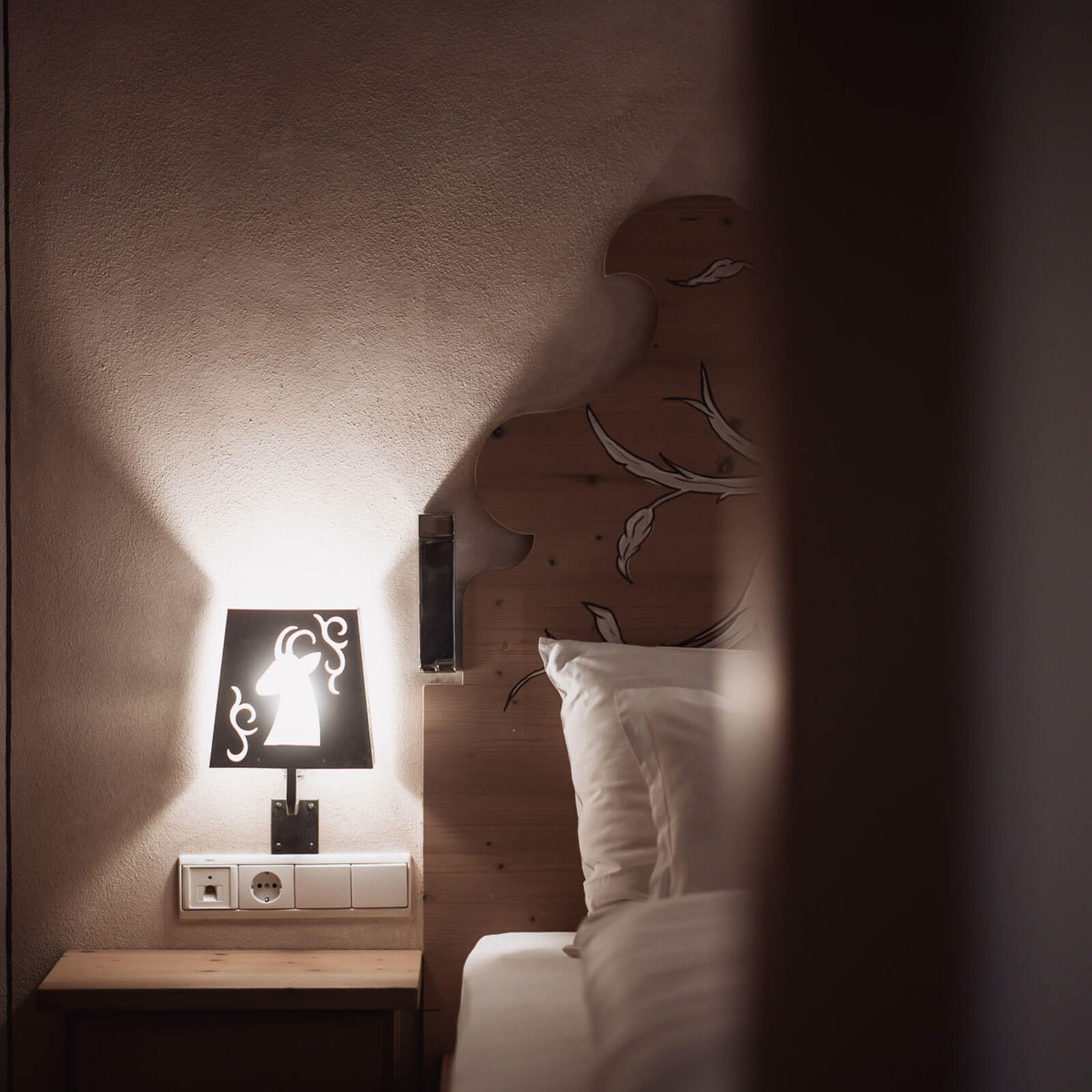 Bedside lamp in the bedroom of the Helmuth Apartment
