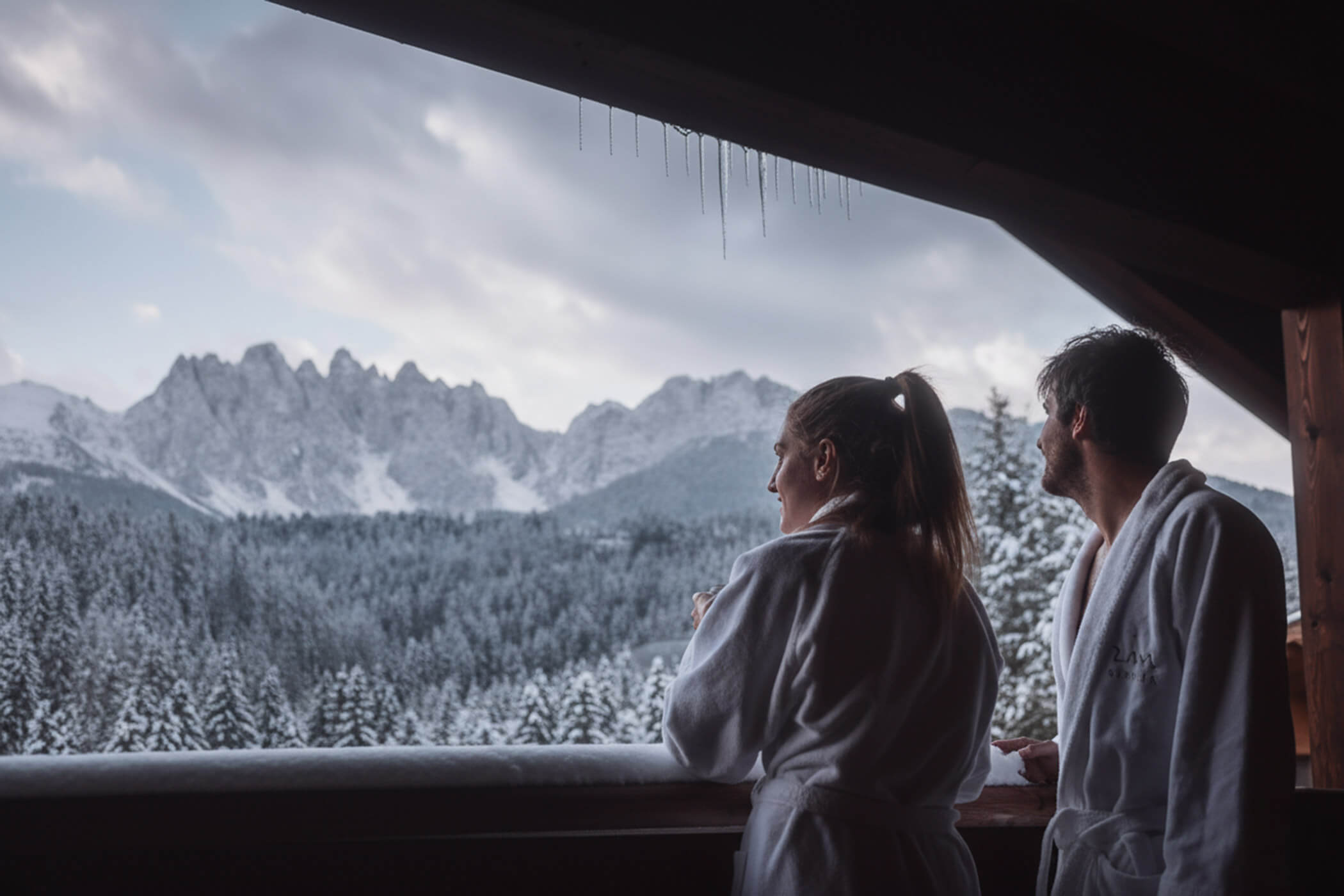 A couple in bathrobes on the balcony